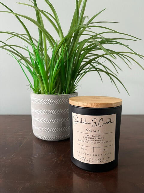 Image is of a candle labeled Paul