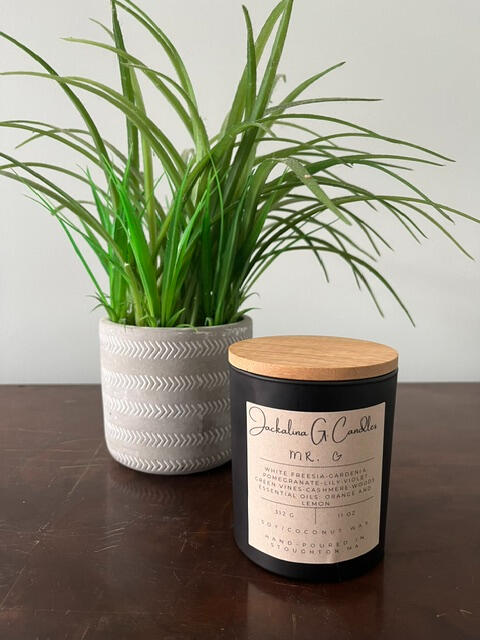 Image is of a candle labeled Mr. G